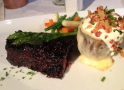 Center Cut Short Ribs served with a raspberry-chipotle glaze, and the baked potato